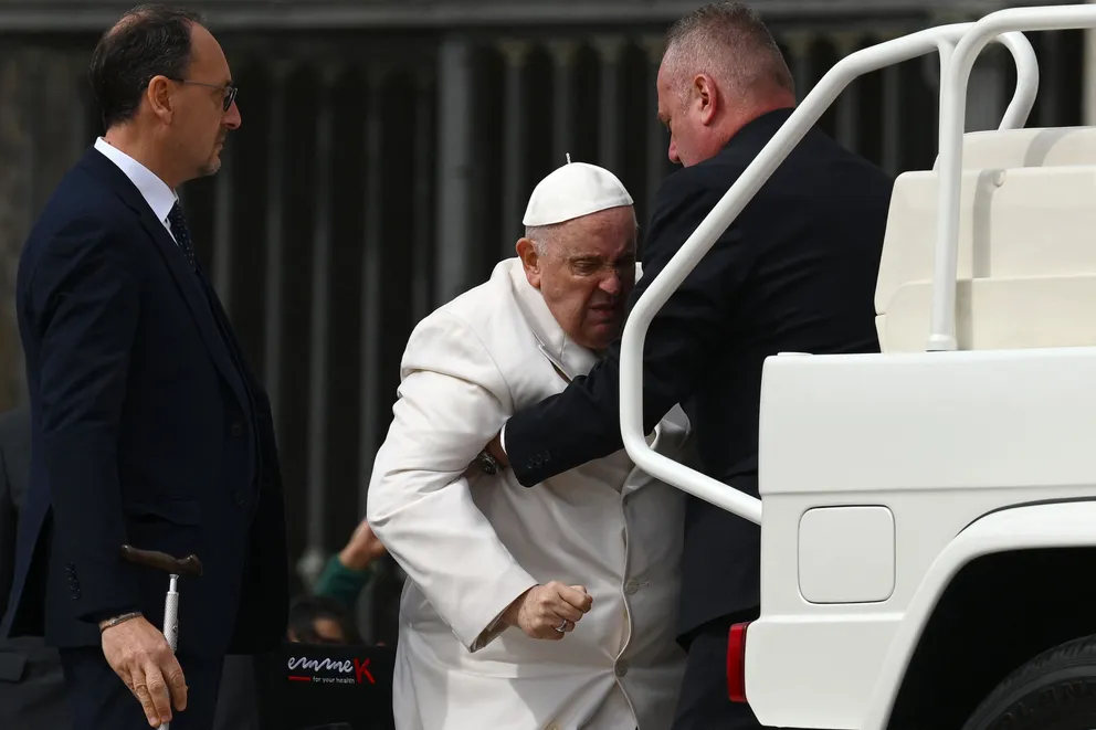 Pope Francis photographed being helped into a popemobile car on March 29, 2023. | Source: Getty Images