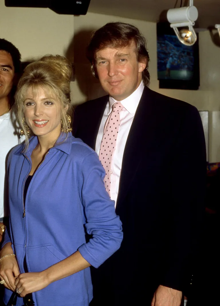 The model and actress poses with Donald Trump, circa 1991 | Source: Getty Images