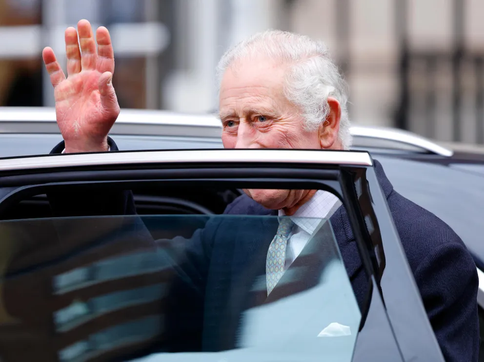 King Charles III waving at people before getting into his car. | Source: Getty Images
